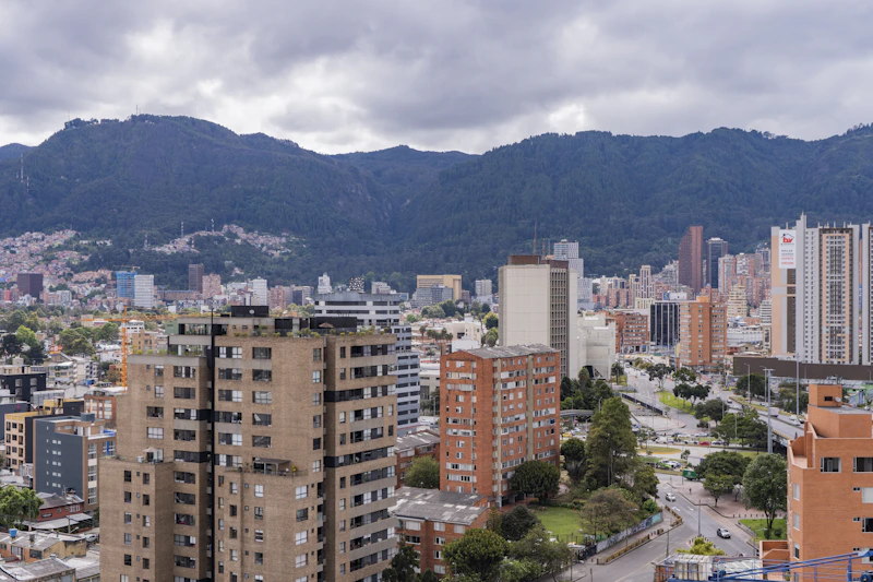 City buildings with mountains in the background
